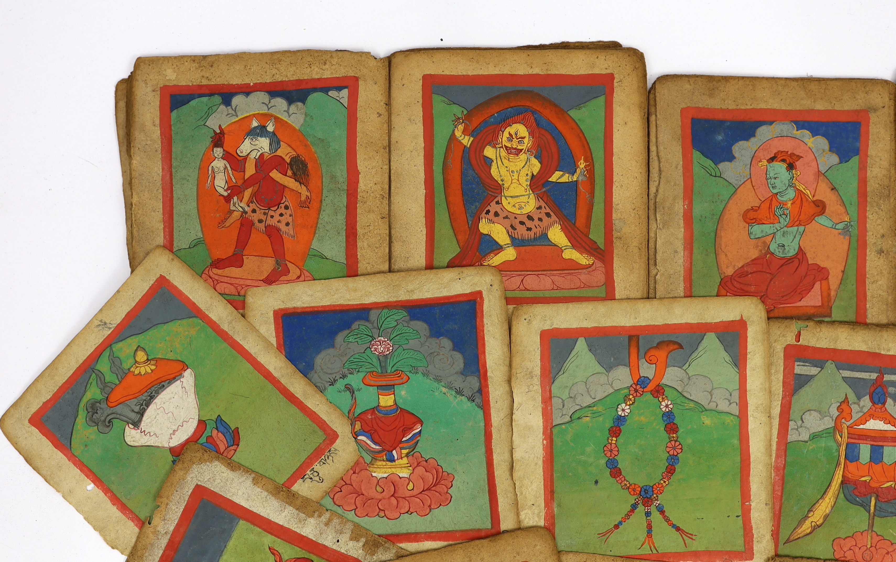 A set of thirty six Tibetan painted thangka pages, 19th century